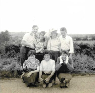 Four standing and three in front, all laughing having fun