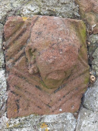 Sandstone carved with geometric design , head protruding | B. Doherty 2024