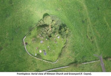 Aerail picture of Kilmeen graveyard, trees to the north and sub circular enclosure around the perimeter