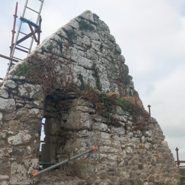 Interior gable of Kilccoley Church, scaffold in place, pointed apex and window visible off centre | B. Doherty 2025