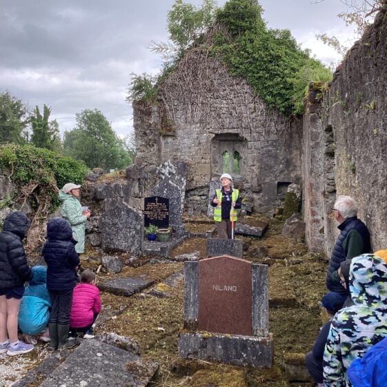 Group of people within ruins of Killora Church | Carmel O'Riordan