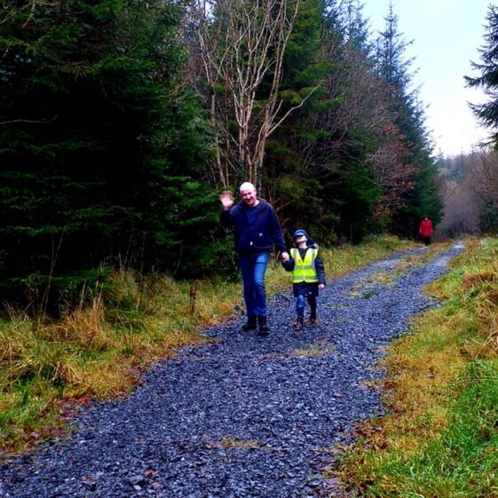 Adult and child waving at camera | Orla Doherty 2019