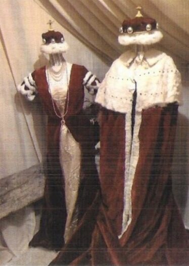 Crimson robes with ivory trimmimgs