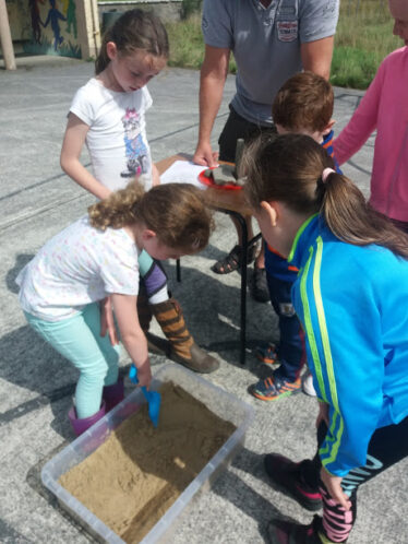 Children excavate for artefacts