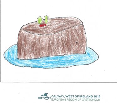 Christmas pudding on a blue plate with holly on top