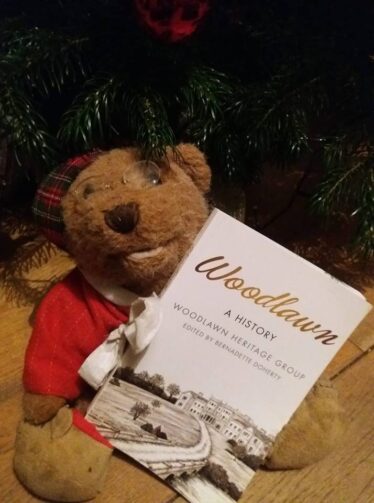 Teddy holding Woodlawn - A History