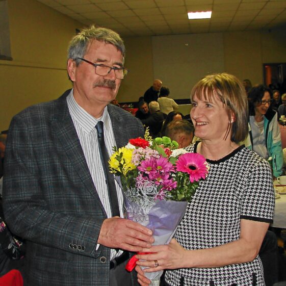 img_47-1-copies Tom Seale presents Chris Doherty with bouquet of flowers in appreciation of her service in Woodlawn Post Office | Alf Seale