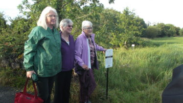 Angela Magennis, and Maeve's sisters unveil new signage for Golden Mile