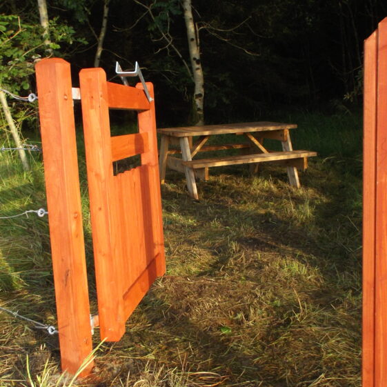 Open Gate Picnic area near river, Woodlawn, open gate showing wooden bench | B. Doherty 2019