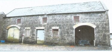 Front elevation of stable buildings prior to restoration