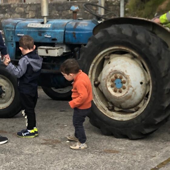 IMG-20220925-WA0020 blue tractor with two children looking around it | Mountbellew Vintage Club