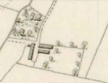 Map of Annagh showing a buildings, trees and a road