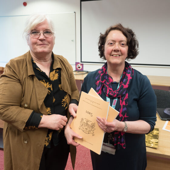 Ruaidhri Ó Flaithearta Mary O'Shea of Moycullen Historical Society presents a copy of their publication Lorg to Marie Boran of The James Hardiman Library NUIG for future referencing | Seán Ó Mainnín