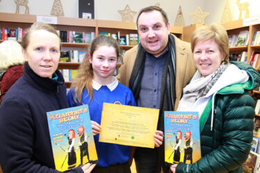 At the book launch of "Ruaidhri's Story how Moycullen got its name" L-R Jacinta Noone, Ava McCarthy, Ollie Turner who launched the publication and Marian Noone.