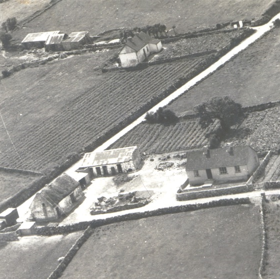 Kyne's Mobile Shop at the home of Johnny McDonagh, Knockarasser c1950s. Sullivans Homestead in the background. Kyne's Mobile Shop at Knockarasser c1950s | Photo Courtesy Kevin Kyne