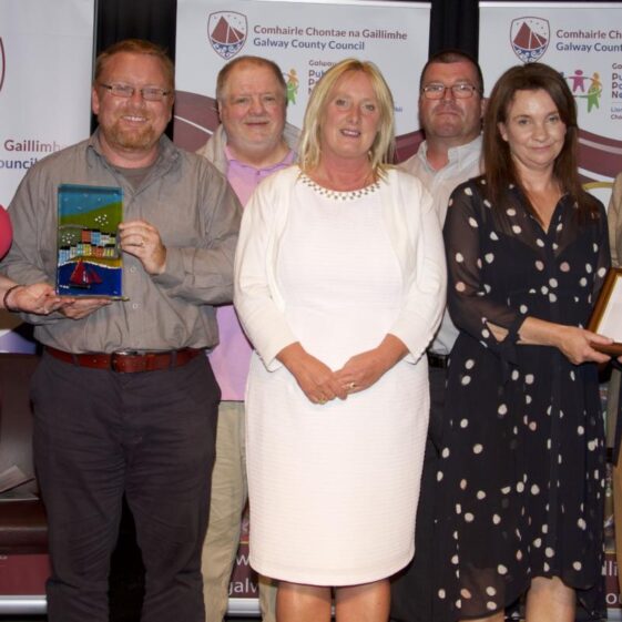 Pictured at the Cathaoirleach’s Community Awards ceremony at The Theatre, Station House Hotel, Clifden were Best Contribution to Heritage Award Winning Group Moycullen Historical Society (Left to Right): Cathaoirleach Eileen Mannion, Mark McNally, Thomas Ó Cadhain, Hazel Morrison, Richard Long, Tara De Renzy, David Burke (Introducer of Award, Editor of the Tuam Herald) | Photo:-Mike Shaughnessy