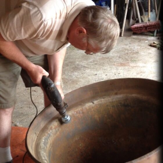 Joe Loughnane carefully restores Moycullen's famine pot | Photo Jerry Nihill