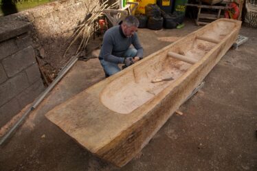 Mark Griffiths works on the replica Lee's Island Log boat