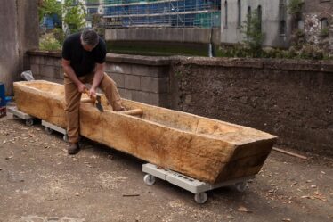 Mark Griffiths works on replica Lee's Island Log boat