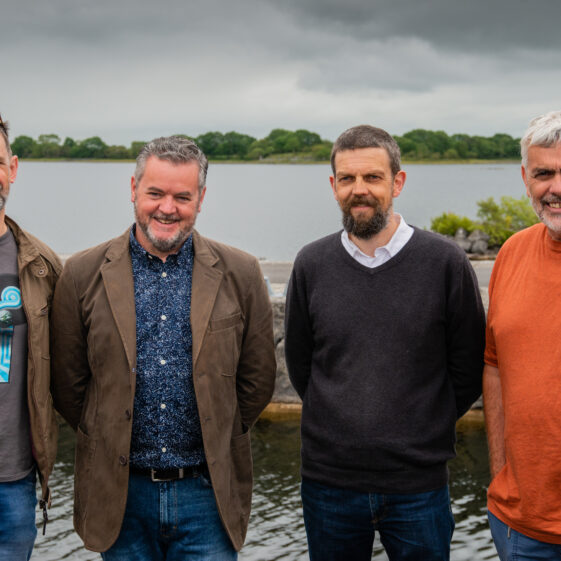 Pallasboy Project founders Dr Ben Gearey (Cork), Mark Griffiths (East Sussex) and Brian MacDomhnaill (Cork) with Jimmy Lenehan (Kilkenny) - with Lough Corrib's Lee's Island in the background | MyOptix