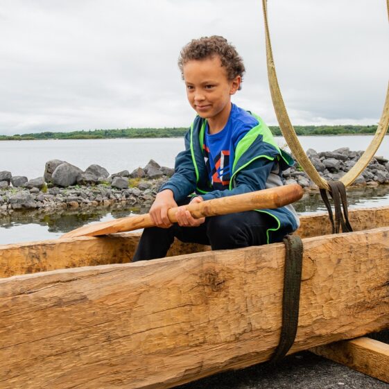 Stephen Evans of Wormhole, Rosscahill, in the replica Lee's Island 5 Log Boat at Knockferry Pier | MyOptix