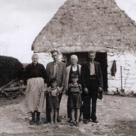 Circa 1940 - Malachy & Mary Bohan and Family.  Car house in the background is still the same and in use today. | Photo:  Mary Croke