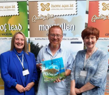 Hazel Morrison-Pagett, Mark McNally (Chairperson) and Bernie Higgins (Hon Secretary) of Moycullen Heritage accept CAHG Conference 2022 award for best display reflecting the theme of the conference - Meitheal