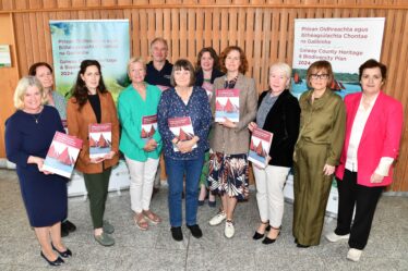 People standing with new book in their hand