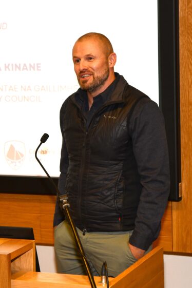Man talking at microphone