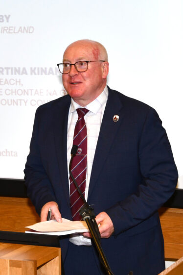 Big man talking at microphone