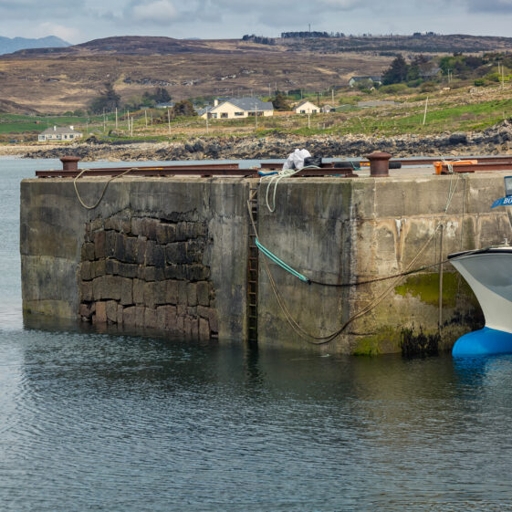 Cleggan Pier showing the stonework of the original pier that the present one was built around.  | Roger Harrison