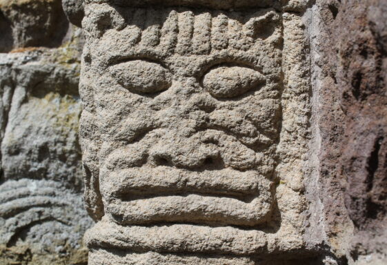 Ornate cat mask carved in sandstone
