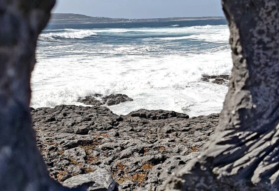 The sea and Inis Meain through the eye of the memorial to those lost at sea