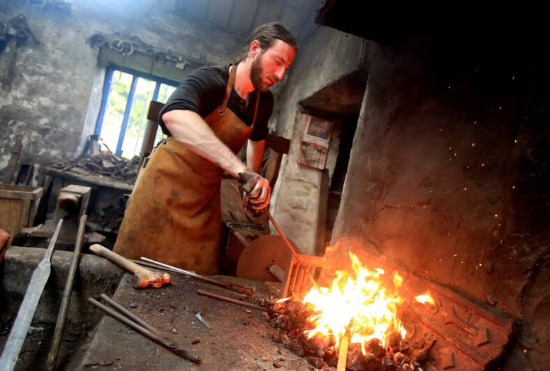 The only sword smith in Ireland, Charlie Gallagher displaying the old way of sword forging at the re-opening of the restored 