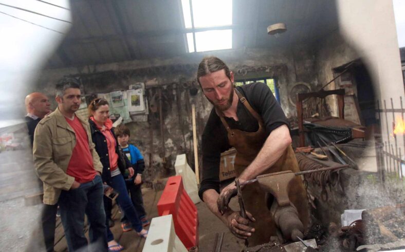 The only sword smith in Ireland, Charlie Gallagher displaying the old way of sword forging at the re-opening of the restored 