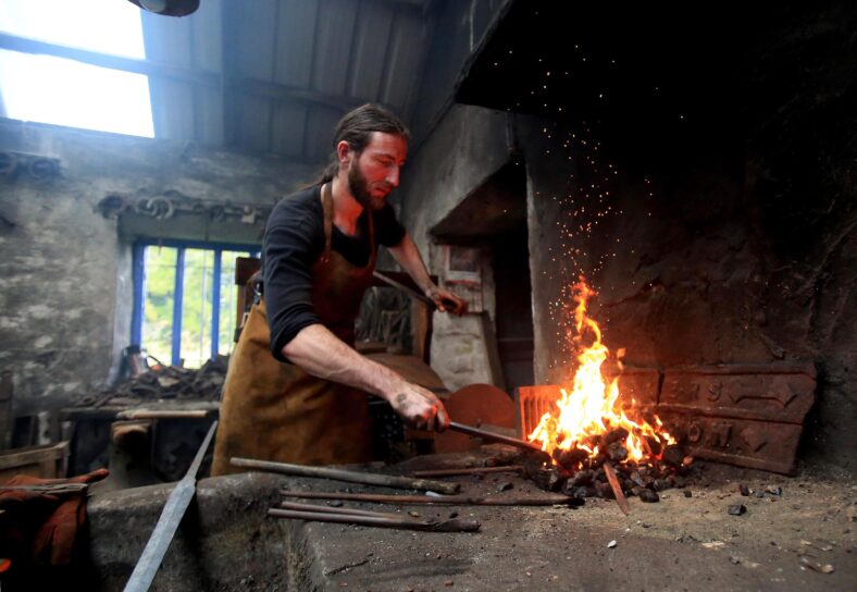 The only sword smith in Ireland, Charlie Gallagher displaying the old way of sword forging at the re-opening of the restored 