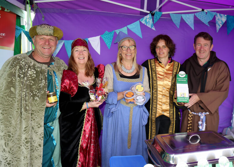 Locals, Noel Leahy of Sliabh Aughty Hone, Anita Dunne of Healthy treats Kitchen, Martha Ryan of Ivy House chocolates and Martina and Joe Corry of Kylenmore Acres displaying their products at Loughrea Medieval Festival.
