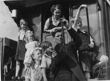 Family on the front of the kitchen wagon 1949 |  Photo Courtesy of Maurice Lyons