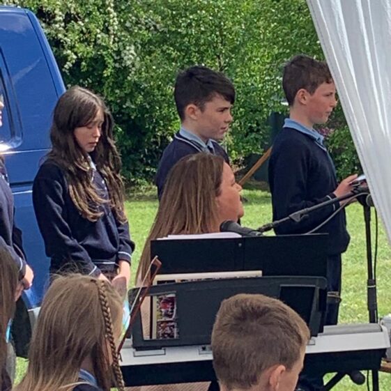 Under the watchful eye of their teacher